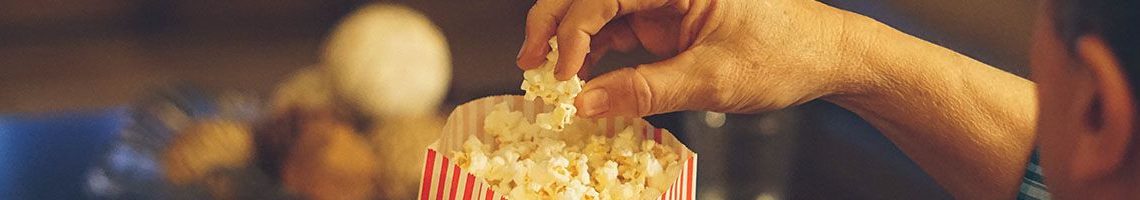 Someone Eating Popcorn At The Movies