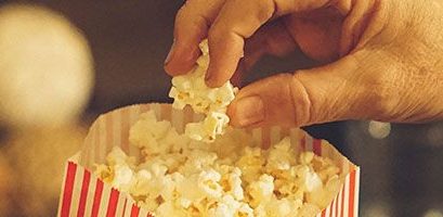 Someone Eating Popcorn At The Movies