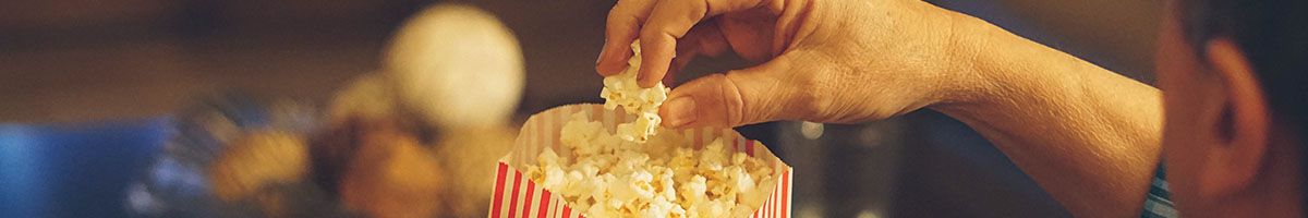 Someone Eating Popcorn At The Movies